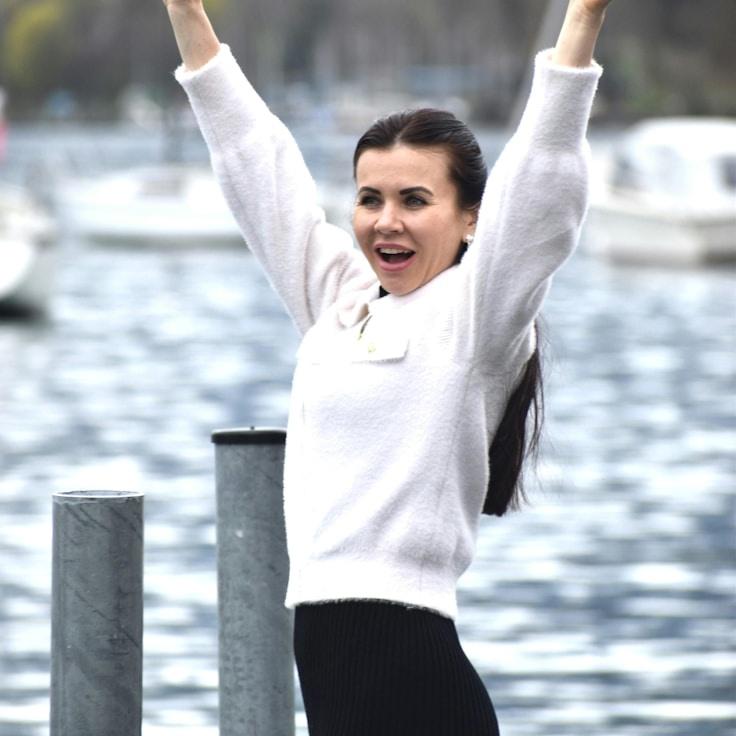 Kaveri Mehta, Lead Design Curator at CoolRidgeWorks, reviewing corporate floral arrangements
